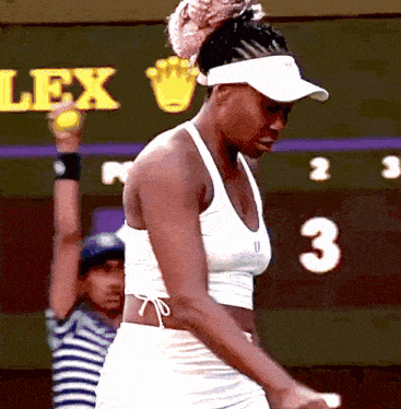 a tennis player stands in front of a scoreboard that says lex
