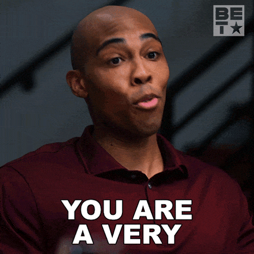 a man in a maroon shirt says beautiful woman in black letters