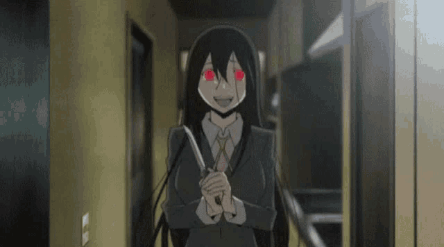 a girl in a suit and tie is holding a knife in her hand .