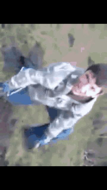 a person is flying through the air with a blurred background
