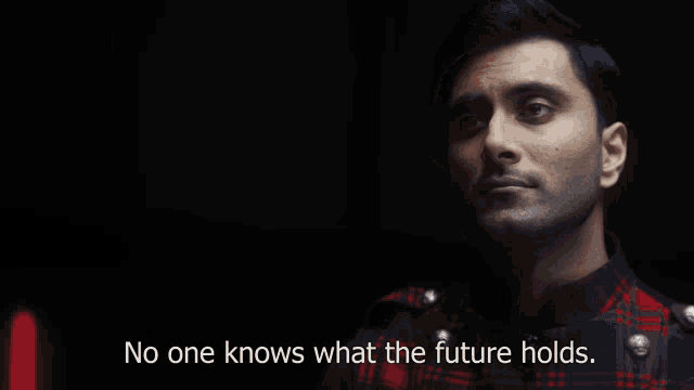 a man in a plaid shirt is talking about the future