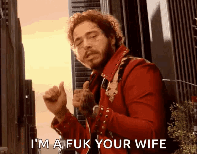 a man in a red jacket is saying i 'm a fuk your wife