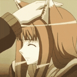 a person is putting a fox ear on a woman 's head