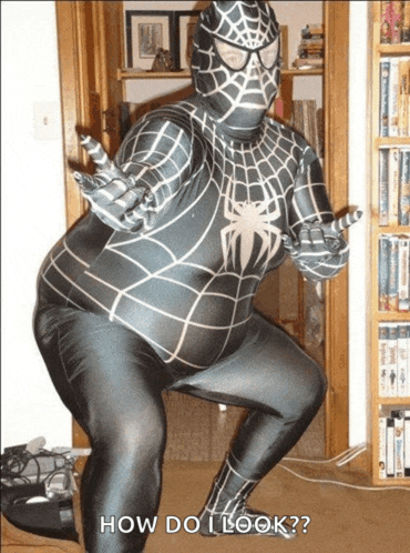 a man in a spiderman costume is standing in front of a bookshelf asking how do i look