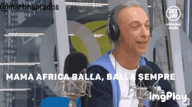 a man wearing headphones is talking into a microphone with the words mama africa balla balla sempre written below him