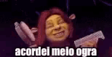 shrek from shrek is smiling and holding a gun in his hands .