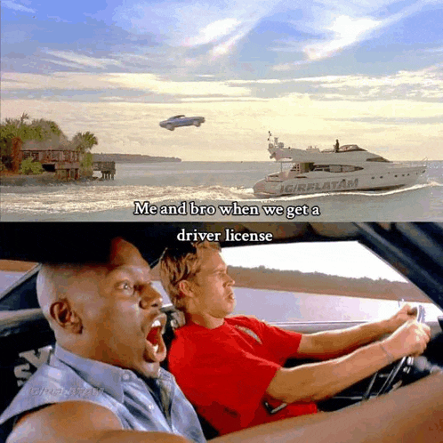 a man driving a car next to a boat that says girlflatm on it