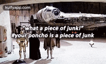 a group of people standing in front of a star wars falcon .