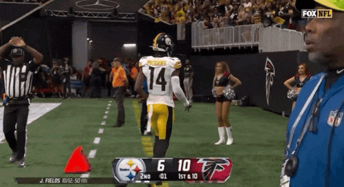 pittsburgh steelers player number 14 is running on the field