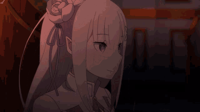a girl with a flower in her hair looks at the camera