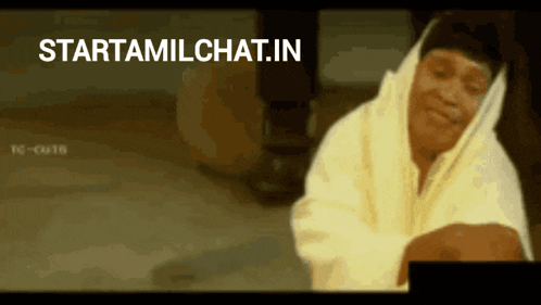 a man in a white hoodie is smiling in front of a starttamilchat.in logo