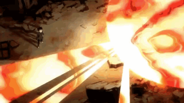 a person is standing in front of a large fireball