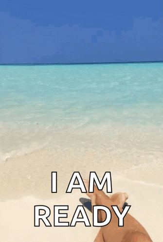 a person laying on a beach with the words " i am ready "