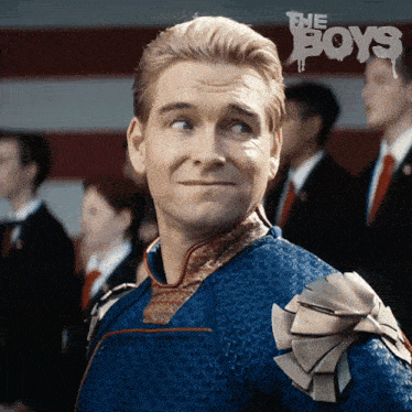 a man in a superhero costume with the word boys on the bottom right