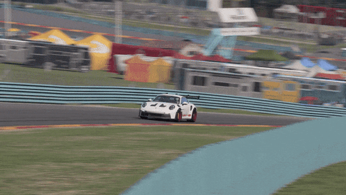 a white race car with the number 47 on the front