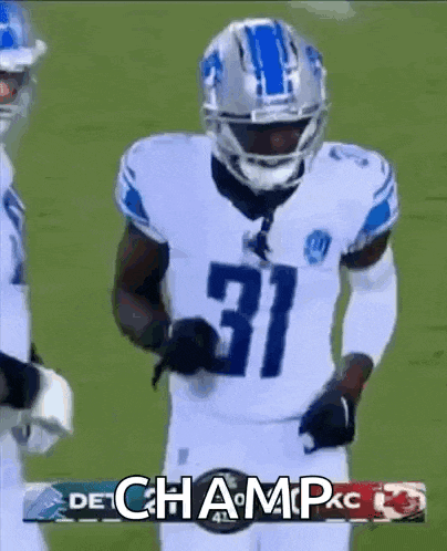 a football player with the number 31 on his jersey stands on the field