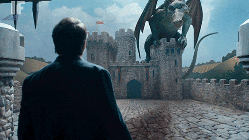 a man stands in front of a castle with a dragon in the background and the letters if visible