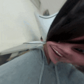 a close up of a person 's face with a blurred image