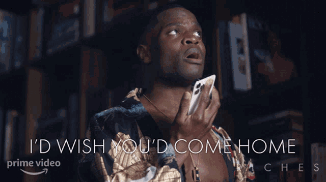 a man holding a cell phone with the words " i 'd wish you 'd come home " below him