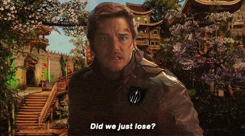 a man is standing in front of a building with the words did we just lose on the bottom