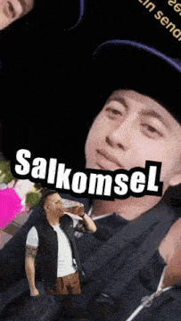a man drinking from a bottle with salkomsel written on the bottom