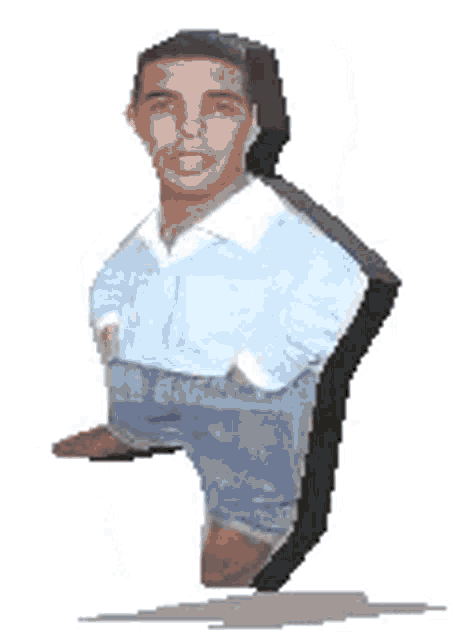a man in a blue shirt is standing next to a black block .