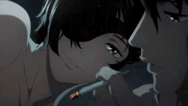 a close up of a man and a woman kissing in a cartoon .