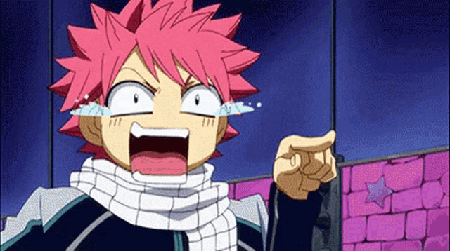 a cartoon character with red hair and tears coming out of his eyes is pointing at someone .