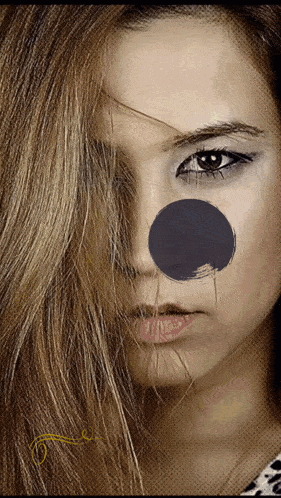 a woman with a black circle on her nose