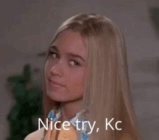 a blonde woman with the words nice try kc written on her face