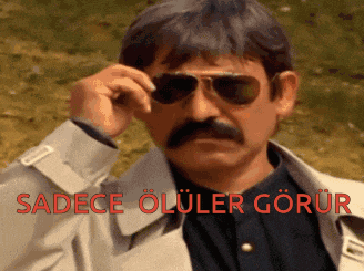 a man with a mustache wearing sunglasses and a trench coat has the word sadece on the bottom