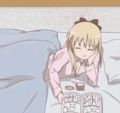 a girl is laying on a bed reading a book with the word kwan written on her hair