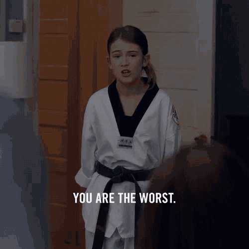 a girl in a taekwondo uniform says " you are the worst "
