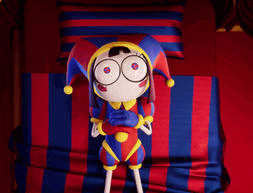 a cartoon jester doll is laying on a bed