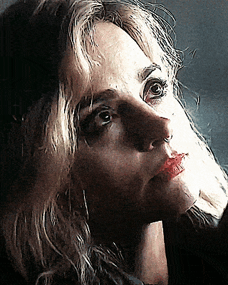 a close up of a woman 's face with red lips