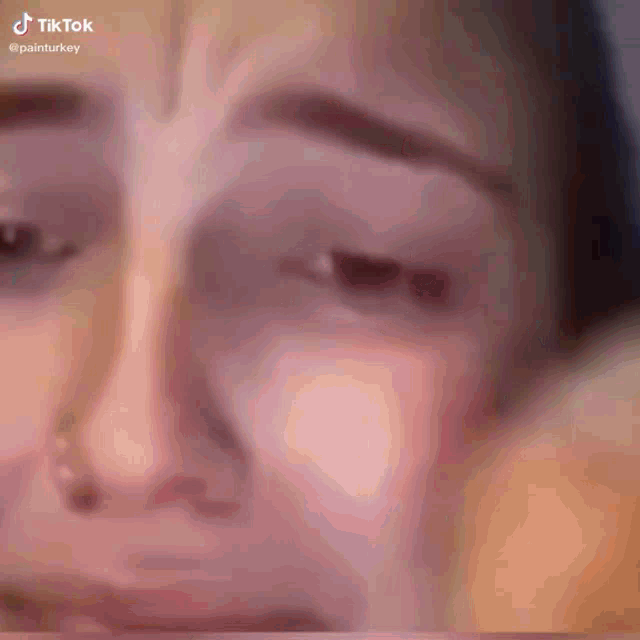 a close up of a woman 's face with a tiktok watermark on the bottom
