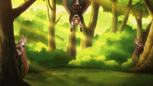 a girl is hanging upside down in the woods