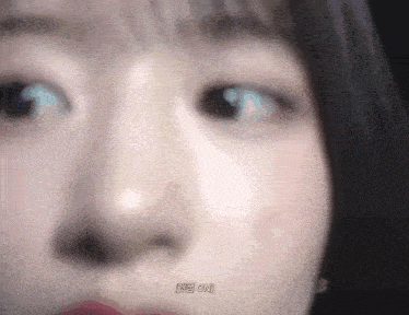 a close up of a woman 's face with the words he 's on written on the bottom .