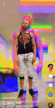 a man named lance archer is standing in front of a rainbow background