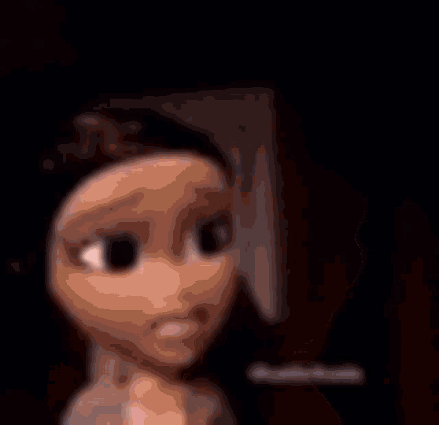a couple of cartoon dolls standing next to each other in a dark room .