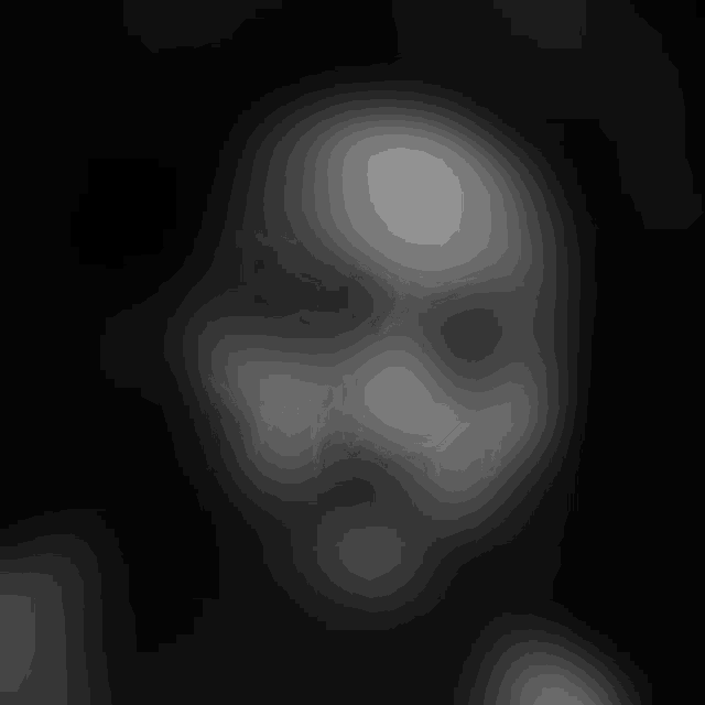 a black and white photo of troy miller 's face