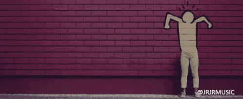 a red brick wall with a drawing of a person on it and the words jrjrmusic below it