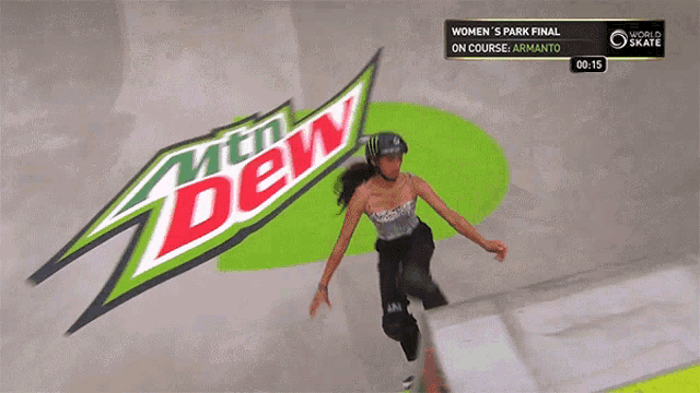 a woman is skateboarding in front of a mountain dew sign