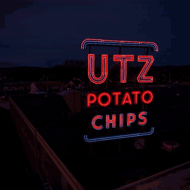a neon sign that says utz potato chips