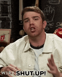 a man in a white jacket is saying " wire shut up "