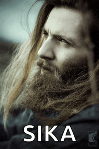 a man with long hair and a beard has the word sika on the bottom right