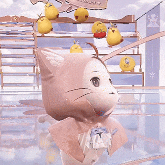 a stuffed animal with a hood and a bow on it