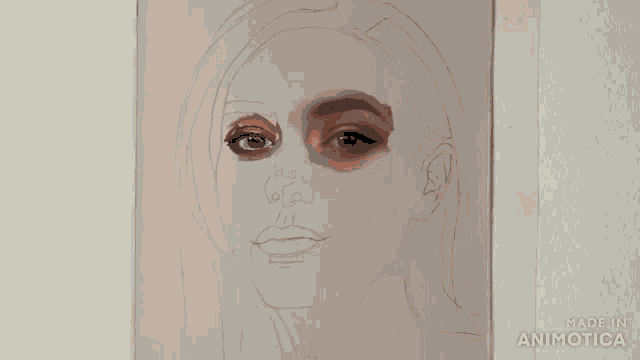 a person is painting a woman 's face and the words made in animotica can be seen in the corner