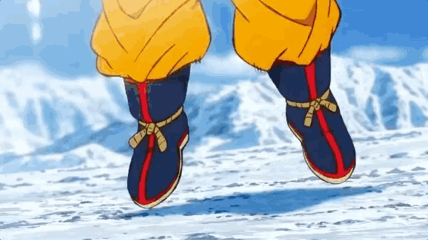 a close up of a person 's feet wearing a pair of blue and red shoes .
