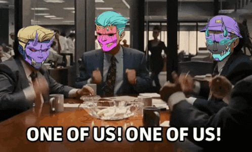 a group of people are sitting at a table with one of them saying one of us